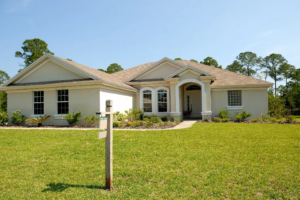 A house with a sign in front of it